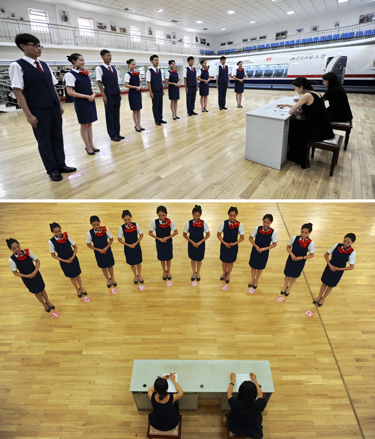 Teachers hold mock interview for the students of flight attendant major in Inner Mongolia Normal University, July, 8, 2013. (Xinhua/Zhao Tingting)  