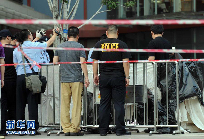 Picture taken on July 17, 2013 shows the crime scene protected by the police. (Photo/Xinhua) 