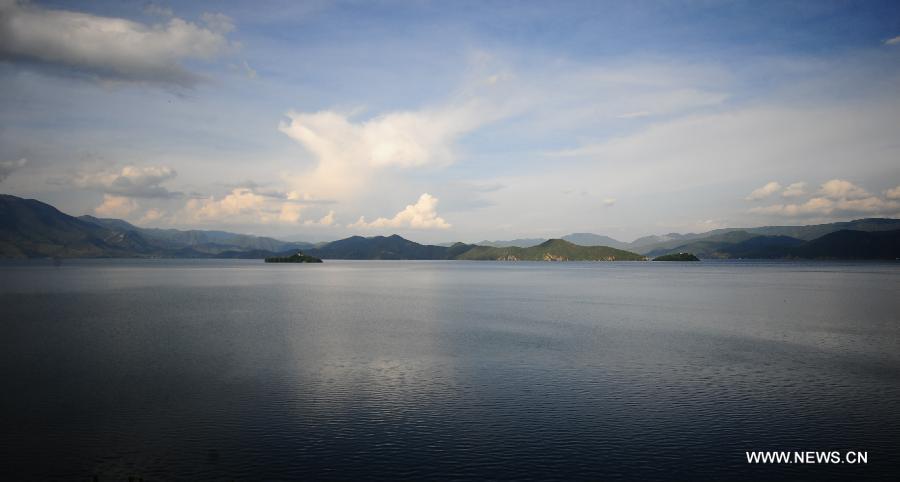 Photo taken on July 16, 2013 shows the scenery at the Lugu Lake in the Yi Autonomous County of Ninglang, southwest China's Yunnan Province. Lugu is renowned for its beautiful scenery and the maintenance of the unique matriarchal system observed by the indigenous Mosuo people. (Xinhua/Qin Lang)