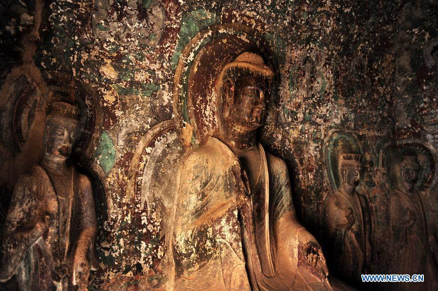 Buddhist statues are seen at the Bingling Temple Grottoes in Yongjing County, northwest China's Gansu Province, July 17, 2013. Listed as part of the ancient Silk Road for the World Heritage candidate, the grottoes will be reviewed by experts from U.N. Educational, Scientific and Cultural Organization after renovation of a giant Buddha statue dating back more than 1,000 years to the Tang Dynasty was completed lately. Bingling Temple Grottoes, filled with Buddhist statues, stupas and murals, were a work in progress between the 4th and 10th centuries. (Xinhua/Nie Jianjiang)