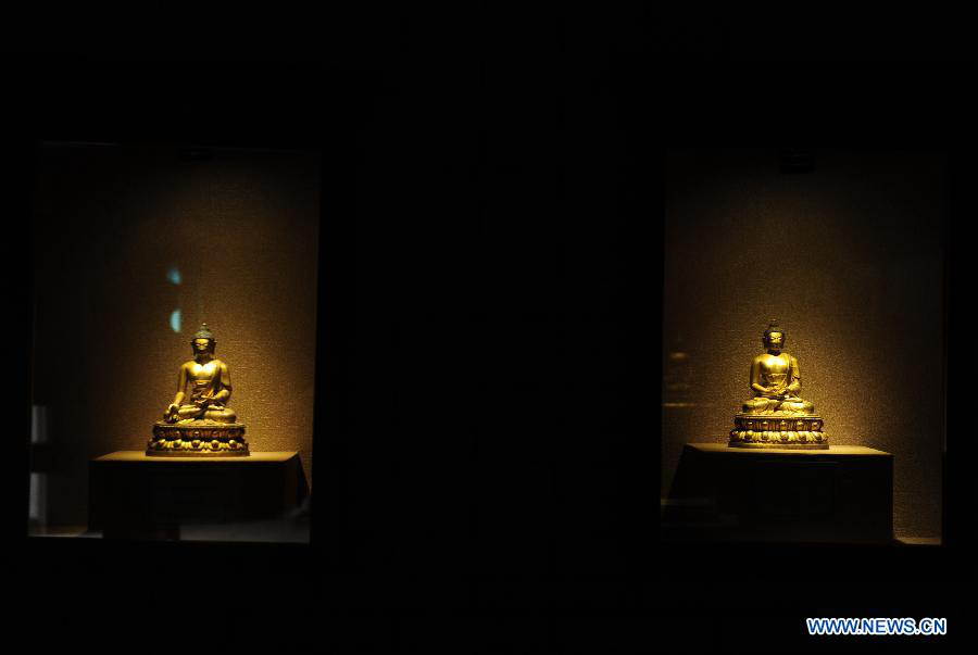 Buddhist statues are on display at the Bingling Temple Grottoes in Yongjing County, northwest China's Gansu Province, July 17, 2013. Listed as part of the ancient Silk Road for the World Heritage candidate, the grottoes will be reviewed by experts from U.N. Educational, Scientific and Cultural Organization after renovation of a giant Buddha statue dating back more than 1,000 years to the Tang Dynasty was completed lately. Bingling Temple Grottoes, filled with Buddhist statues, stupas and murals, were a work in progress between the 4th and 10th centuries. (Xinhua/Nie Jianjiang)