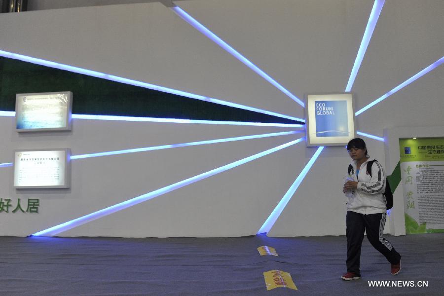 A girl visits the first China Ecological Products (Technologies) Expo in Guiyang, capital of southwest China's Guizhou Province, July 19, 2013. The five-day expo, a key part of the 2013 Eco-Forum Global Annual Conference, kicked off here Friday. More than 260 exhibitors will attend the expo to introduce their advanced concepts and techniques in the filed of ecology. (Xinhua/Ou Dongqu)