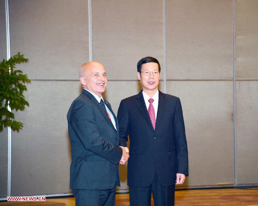 Chinese Vice Premier Zhang Gaoli (R) shakes hands with Swiss President Ueli Maurer in Guiyang, capital of southwest China's Guizhou Province, July 19, 2013. Zhang Gaoli on Friday met with four foreign leaders who will attend the opening ceremony of the Eco-Forum Global in Guiyang. (Xinhua/Wang Ye)