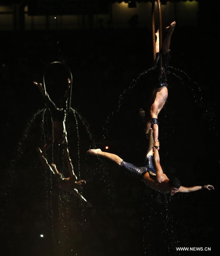 Acrobats perform during the Opening Ceremony of the 15th FINA World Championships at Palau Sant Jordi in Barcelona, Spain on July 19, 2013. (Xinhua/Wang Lili)