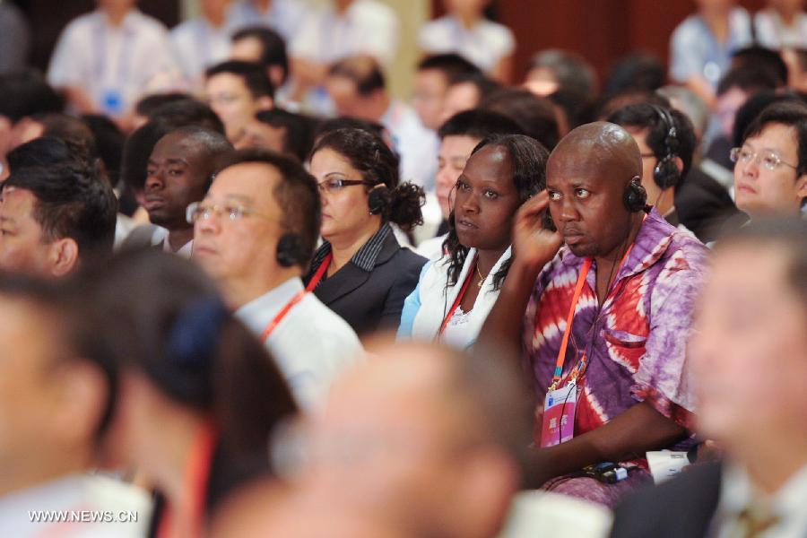 Delegates attend the opening ceremony of the Eco Forum Global Annual Conference Guiyang 2013 in Guiyang, capital of southwest China's Guizhou Province, July 20, 2013. Over 2,000 participants from home and abroad attended the conference themed on "Building Eco-Civilization: Green Transformation and Transition". (Xinhua/Ou Dongqu) 