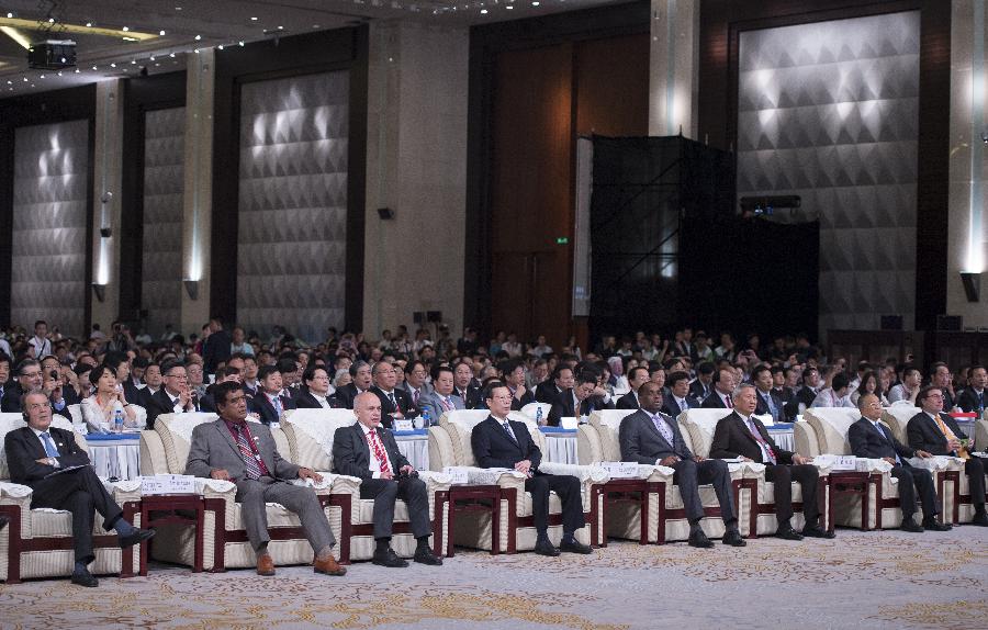 Chinese Vice Premier Zhang Gaoli (4th L, front), also a member of the Standing Committee of the Political Bureau of the Communist Party of China Central Committee, attends the opening ceremony of the Eco Forum Global Annual Conference 2013 in Guiyang, capital of southwest China's Guizhou Province, July 20, 2013. Zhang read out Chinese President Xi Jinping's congratulatory letter on the opening of the conference and delivered a speech here on Saturday. (Xinhua/Wang Ye) 