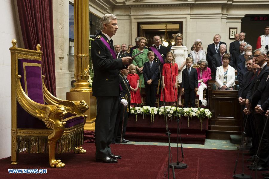 Belgium's newly sworn in King Philippe and his family meet the people from the balcony of Royal Palace in Brussels, capital of Belgium, on July 21, 2013, the country's national day. Prince Philippe was sworn in before parliament as Belgium's seventh king on Sunday, after his father Albert II abdicated. (Xinhua/Ye Pingfan)