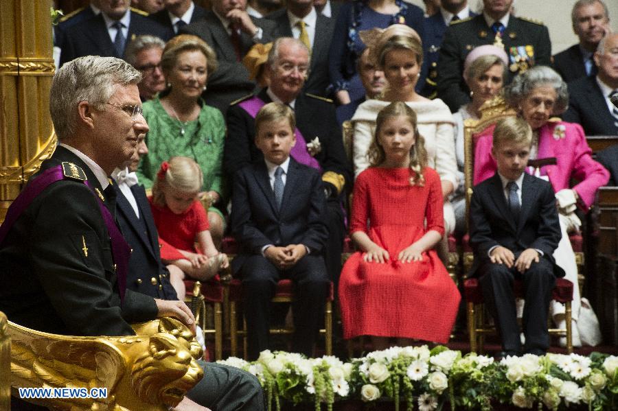 King Philippe of Belgium (L) sits on the throne after taking the oath during a ceremony at the Belgian Parliament in Brussels, on July 21, 2013. Prince Philippe was sworn in before parliament as Belgium's seventh king on Sunday, the country's national day, after his 79-year-old father Albert II abdicated. (Xinhua/POOL)