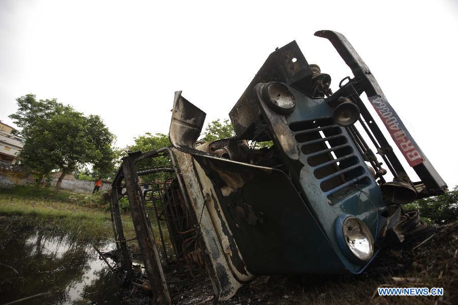 A vehicle destroyed by villagers whose children were killed in a mass food poisoning, is seen in the village of Gandaman, Saran District of eastern Indian state of Bihar, July 20, 2013. At least 23 children, all below 12 years, were confirmed dead due to food poisoning after eating a free mid-day school meal in the eastern Indian state of Bihar on July 16, 2013. (Xinhua/Zheng Huansong) 