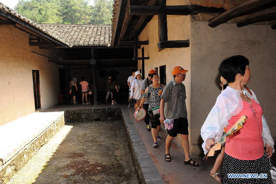 Tourists visit the Former Residence of Chairman Mao Zedong located in Shaoshan Township of Xiangtan City, central China's Hunan Province, July 19, 2013. This year marks the 120th Anniversary of Mao Zedong's Birth, many tourists come to the Former Residence of Chairman Mao Zedong which is a national site for patriotic education.(Xinhua/He Changjun)