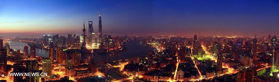 The combined photo taken on July 23, 2013 shows a scenery of downtown Shanghai, east China, in the early morning. (Xinhua/Zhu Yingying) 