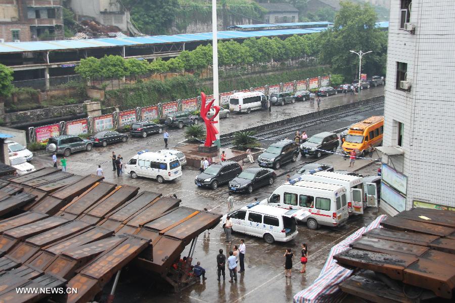 Ambulances wait outside the accident site at the Shanmushu Coal Mine, which is owned by the Sichuan Coal Group Furong Company, in Gongxian County of Yibin City, southwest China's Sichuan Province, July 23, 2013. Seven people remained trapped while 266 others have successfully escaped after the coal mine accident early on Tuesday morning. The seven trapped miners are all members of a team that was draining gas from the shaft. (Xinhua/Yi Youbo)