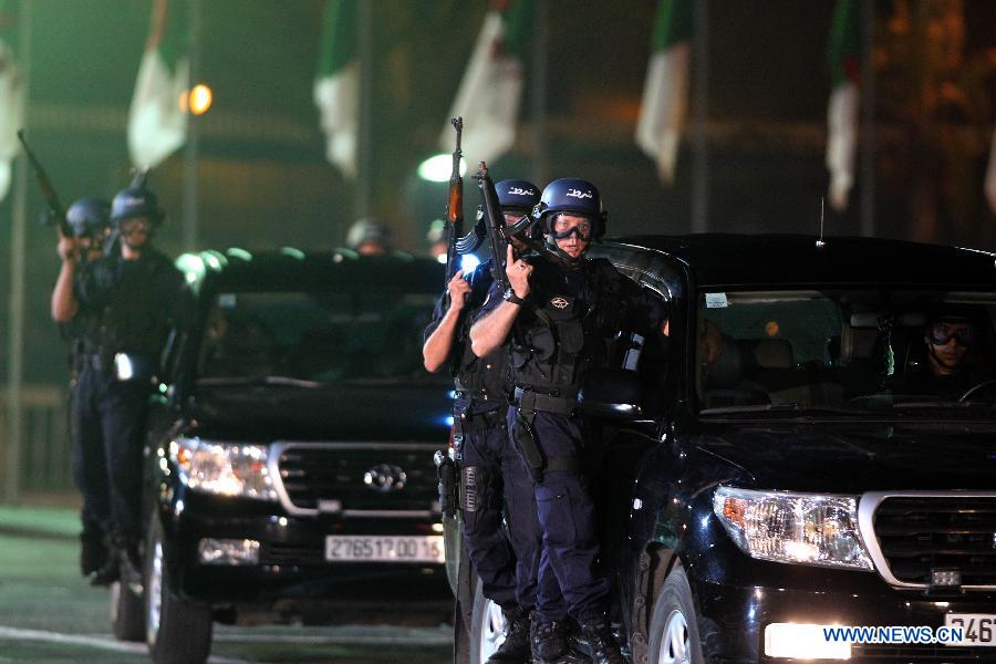 Algeria's special police force perform exercises during a ceremony to commemorate Algeria's 51st national police day in Algiers, Algeria, July 22, 2013. (Xinhua/Mohamed Kadri)