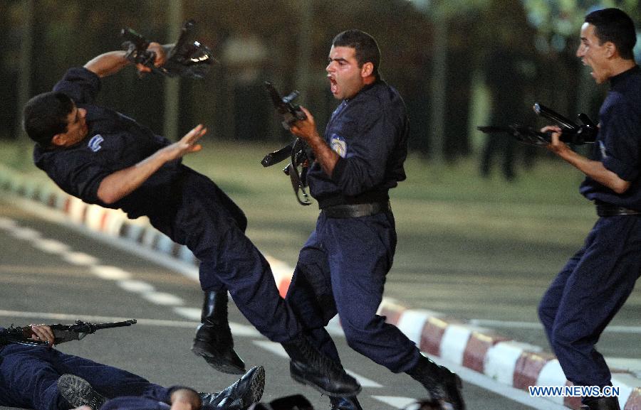 Algeria's special police force perform exercises during a ceremony to commemorate Algeria's 51st national police day in Algiers, Algeria, July 22, 2013. (Xinhua/Mohamed Kadri)