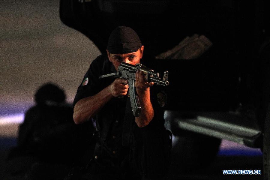 Algeria's special police force perform exercises during a ceremony to commemorate Algeria's 51st national police day in Algiers, Algeria, July 22, 2013. (Xinhua/Mohamed Kadri)