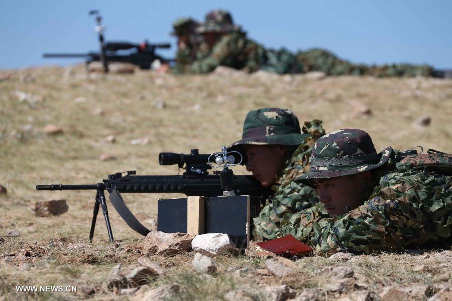 Members of China's People's Liberation Army (PLA) special forces participate in a comprehensive military contest at a PLA training base in north China's Inner Mongolia Autonomous Region, July 23, 2013. (Xinhua/Wang Jianmin)