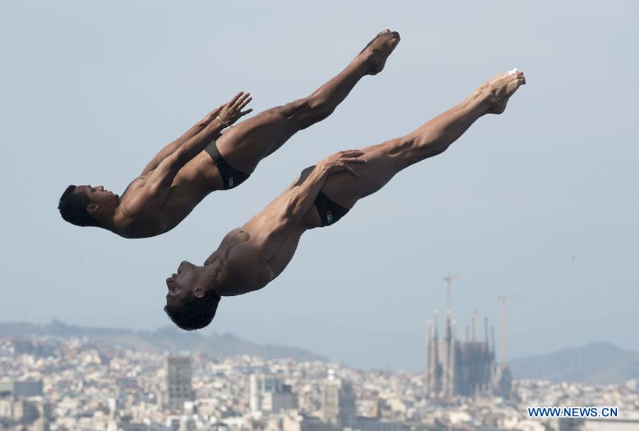 Jahir Ocampo and Rommel Pacheco of Mexico compete during the men's 3m synchro springboard final of the diving competition at the 15th FINA World Championships in Barcelona, Spain, on July 23, 2013. Ocampo and Rommel Pacheco won the bronze with a total score of 422.79 points. (Xinhua/Xie Haining)