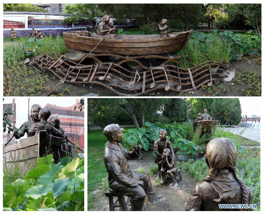 Combined photo taken on July 25, 2013 shows a sculpture named "Let us sway twin oars" at the Beihai Park in Beijing, capital of China. The sculpture is in memory of a Chinese popular song of the same name. (Xinhua/Li Xin)