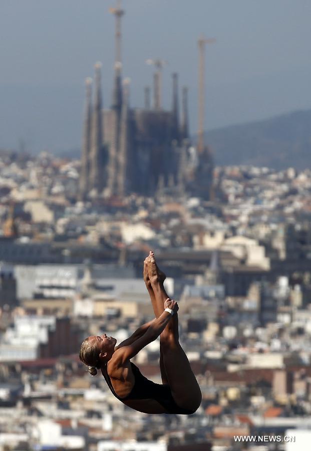 Iuliia Prokopchuk of Ukraine competes in the Women's 10m Platform Final of the Diving competition in the 15th FINA World Championships at the Piscina Municipal de Montjuic in Barcelona, Spain on July 25, 2013. Iuliia Prokopchuk took the bronze with a total score of 358.40 points. (Xinhua/Wang Lili)