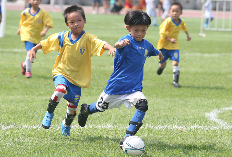 Children's football game held by Beijing Evening News, on July 20, 2013. (Photo/Osports)