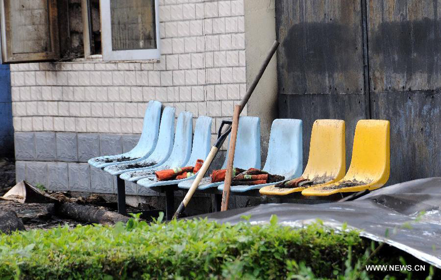 Photo taken on July 26, 2013 shows the accident site at the Lianhe Senior Nursing Home where a fire took place in Hailun City, northeast China's Heilongjiang Province. Eleven people were killed in the fire that occurred early Friday. Local police said arson has been confirmed as the cause of the fire. A total of 283 elderly people were living in the nursing home, which was built in October 2005. With an area of 7,000 square meters, it caters for the rural elderly in the city who have no source of income. (Xinhua/Wang Song)