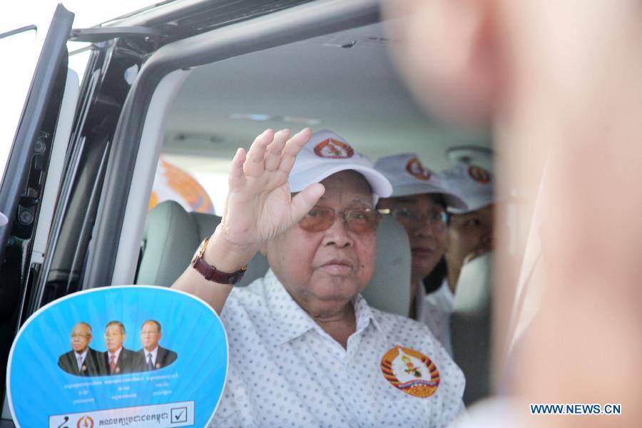 President of the Senate and President of the ruling Cambodian People's Party (CPP) Chea Sim waves to the party's supporters during a campaign rally in Phnom Penh, Cambodia, July 26, 2013. Cambodia's fifth parliamentary elections are ready to kick off on Sunday, a National Election Committee (NEC) official said Friday. (Xinhua/Phearum)