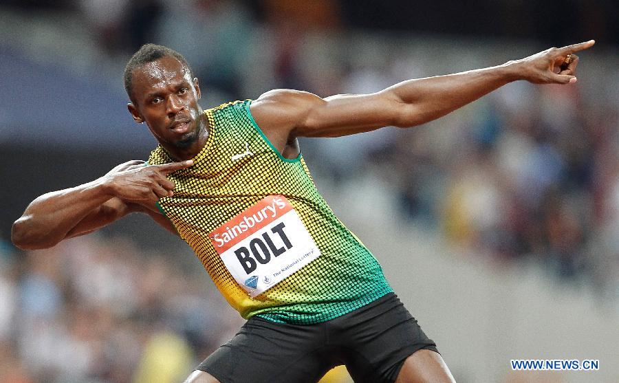 Usain Bolt of Jamaica reacts after winning the men's 100m race at the London Diamond League 'Anniversary Games' athletics meeting at the Olympic Stadium in London, Britain, on July 26, 2013. Bolt claimed the title with 9.85 seconds. (Xinhua/Yin Gang)