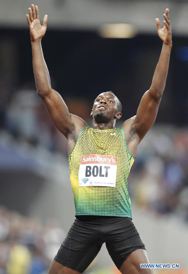 Usain Bolt of Jamaica reacts after winning the men's 100m race at the London Diamond League 'Anniversary Games' athletics meeting at the Olympic Stadium in London, Britain, on July 26, 2013. Bolt claimed the title with 9.85 seconds. (Xinhua/Yin Gang)