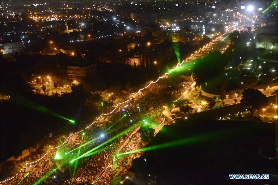 This handout photo released by the Egyptian Army on July 27, 2013, shows pro-military protesters gathering at the Tahrir Square, in Cairo, Egypt, on July 26, 2013. Millions of Egyptians held mass rallies and parade to show their attitude around the country on Friday. Death toll of clashes erupted late Friday between supporters and opponents of Egypt's ousted president Mohamed Morsi has climbed to at least 139 on Saturday, the Muslim Brotherhood (MB) and local media said. (Xinhua/Egyptian Army)