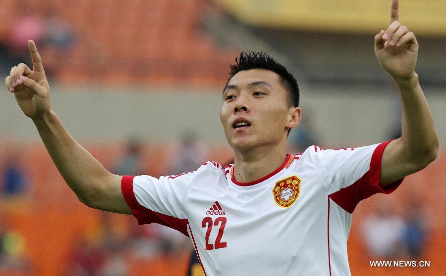 China's Yu Dabao celebrates after scoring a goal during the EAFF East Asian Cup 2013 against Australia at the Jamsil Olympic Stadium in Seoul, South Korea, July 28, 2013. China won the match 4-3. (Xinhua/Park Jin-hee) 