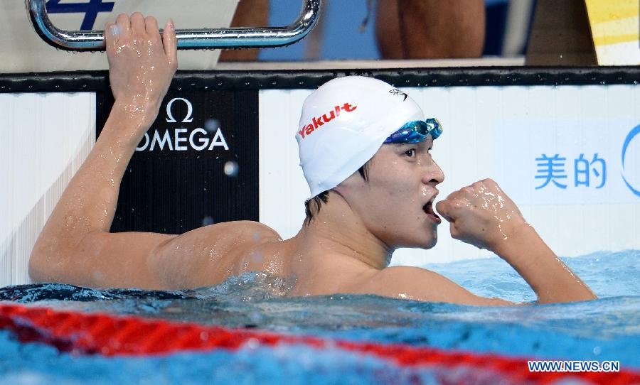 Sun Yang of China celebrates after the Men's 400m Freestyle Final of the Swimming competition on day 9 of the 15th FINA World Championships at Palau Sant Jordi in Barcelona, Spain on July 28, 2013. Sun Yang claimed the title with 3 minutes 41.59 seconds.(Xinhua/Guo Yong) 