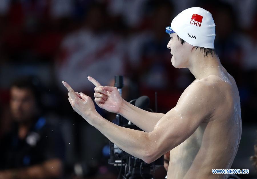 Sun Yang of China celebrates after the Men's 400m Freestyle Final of the Swimming competition on day 9 of the 15th FINA World Championships at Palau Sant Jordi in Barcelona, Spain on July 28, 2013. Sun Yang claimed the title with 3 minutes 41.59 seconds.(Xinhua/Guo Yong) 