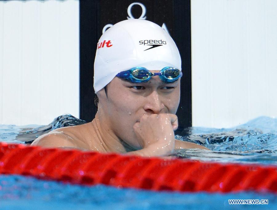 Sun Yang of China celebrates after the Men's 400m Freestyle Final of the Swimming competition on day 9 of the 15th FINA World Championships at Palau Sant Jordi in Barcelona, Spain on July 28, 2013. Sun Yang claimed the title with 3 minutes 41.59 seconds.(Xinhua/Guo Yong) 