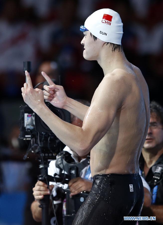 Sun Yang of China celebrates after the Men's 400m Freestyle Final of the Swimming competition on day 9 of the 15th FINA World Championships at Palau Sant Jordi in Barcelona, Spain on July 28, 2013. Sun Yang claimed the title with 3 minutes 41.59 seconds.(Xinhua/Guo Yong) 