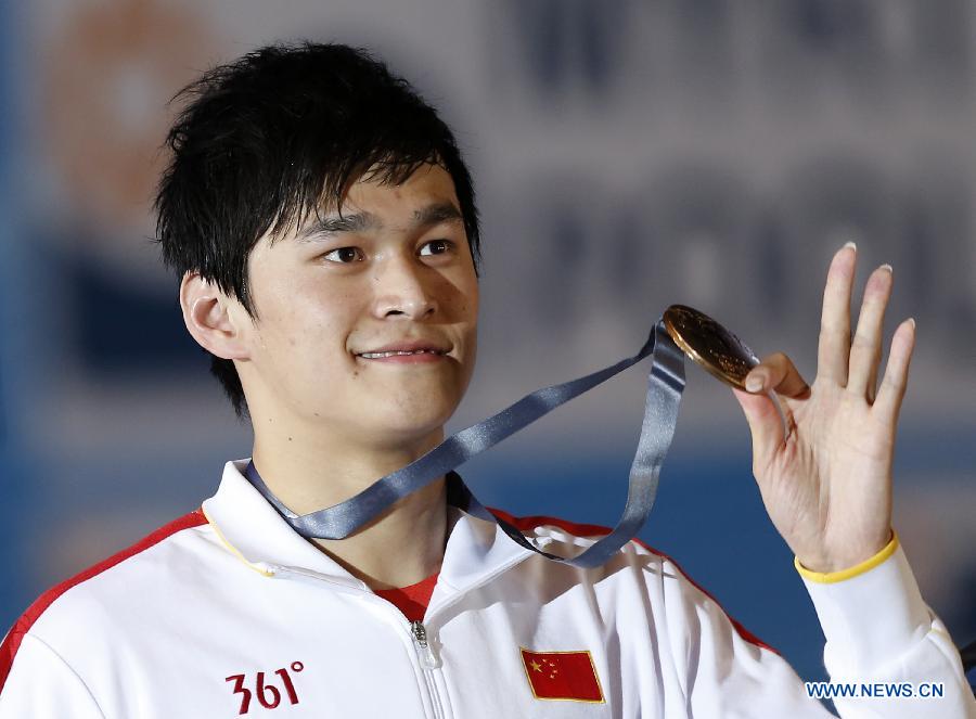 Sun Yang of China celebrates after the Men's 400m Freestyle Final of the Swimming competition on day 9 of the 15th FINA World Championships at Palau Sant Jordi in Barcelona, Spain on July 28, 2013. Sun Yang claimed the title with 3 minutes 41.59 seconds.(Xinhua/Guo Yong) 