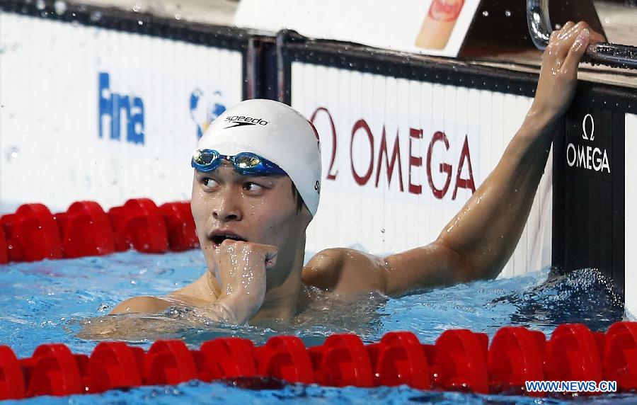 Sun Yang of China celebrates after the Men's 400m Freestyle Final of the Swimming competition on day 9 of the 15th FINA World Championships at Palau Sant Jordi in Barcelona, Spain on July 28, 2013. Sun Yang claimed the title with 3 minutes 41.59 seconds.(Xinhua/Guo Yong) 