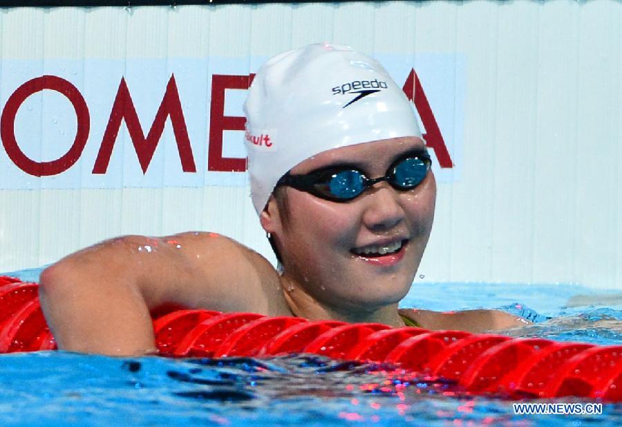 Ye Shiwen of China smiles after the women's 200m medley semifinal of the Swimming competition on day 9 of the 15th FINA World Championships at Palau Sant Jordi in Barcelona, Spain on July 28, 2013. Ye entered the final with 2 minutes 9.12 seconds.(Xinhua/Guo Yong)