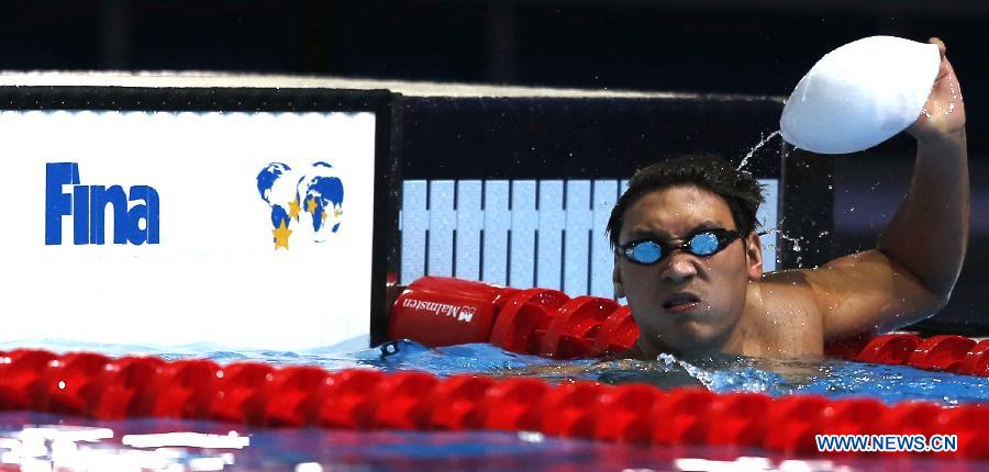 Li Yunqi of China reacts after Men's 200m Freestyle Heats of the Swimming competition on day 10 of the 15th FINA World Championships at Palau Sant Jordi in Barcelona, Spain on July 29, 2013. Li Yunqi advanced to the semifinal with 1:48.18.(Xinhua/Wang Lili)