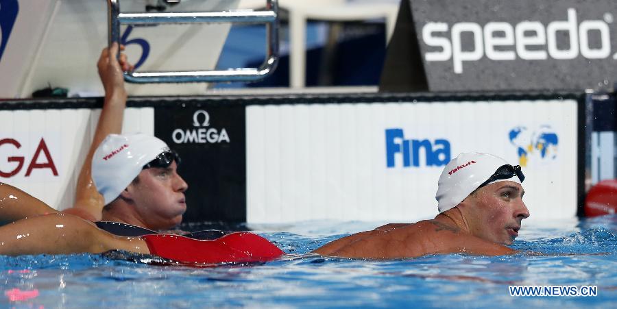 Ryan Lochte (R) of the United States looks at the screen after Men's 200m Freestyle Heats of the Swimming competition on day 10 of the 15th FINA World Championships at Palau Sant Jordi in Barcelona, Spain on July 29, 2013. Ryan Lochte advanced to the semifinal with 1:47.90. (Xinhua/Wang Lili)