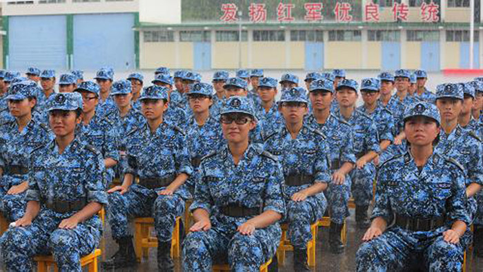 The picture shows Hong Kong teenagers attend a graduation ceremony of the military summer camp on July 28, 2013.  (Photo by Lyu Xiaowei)