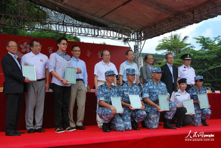 The picture shows Hong Kong teenagers attend a graduation ceremony of the military summer camp on July 28, 2013.  (People's Daily Online/Guo Xiaotong)