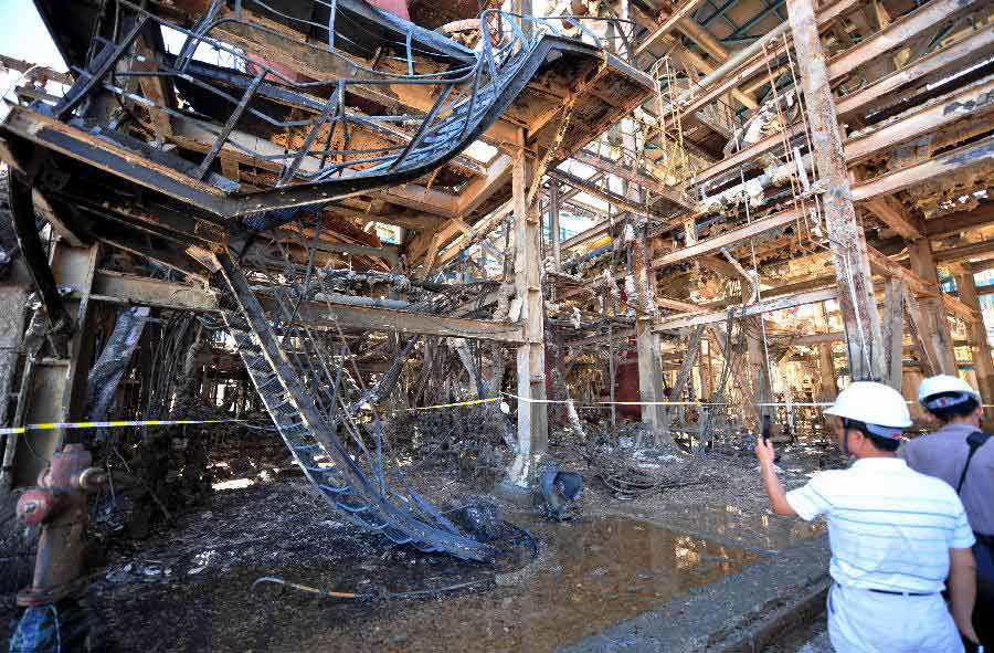 Photo taken on July 30, 2013 shows the accident site at a paraxylene (PX) plant on Gulei Peninsula in Zhangzhou, southeast China's Fujian Province. A flash fire followed by an explosion erupted at the plant at 4:35 a.m.. The fire has been brought under control and no casualties have been reported. An initial investigation found that a cracked hydrogen pipeline triggered the fire during a pressure test. (Xinhua/Wei Peiquan)