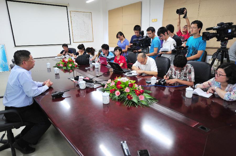 President of a paraxylene (PX) plant where a flash fire erupted speaks at a press conference on Gulei Peninsula in Zhangzhou, southeast China's Fujian Province, July 30, 2013. A flash fire followed by an explosion erupted at the plant at 4:35 a.m.. The fire has been brought under control and no casualties have been reported. An initial investigation found that a cracked hydrogen pipeline triggered the fire during a pressure test. (Xinhua/Wei Peiquan)