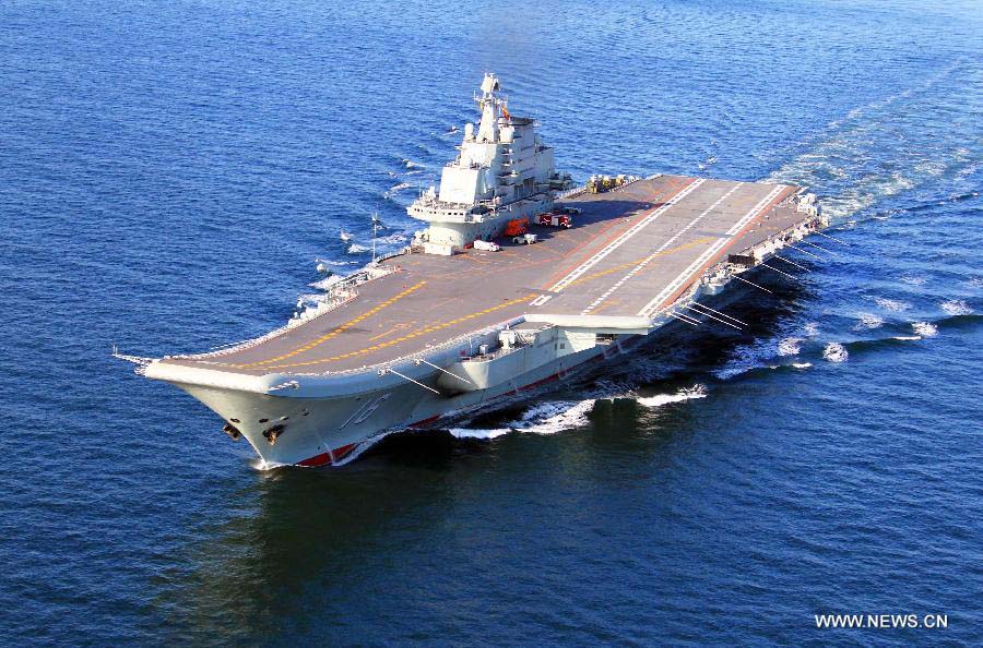 This undated photo shows China's first aircraft carrier, the Liaoning, sailing on the sea. (Xinhua/Zha Chunming)