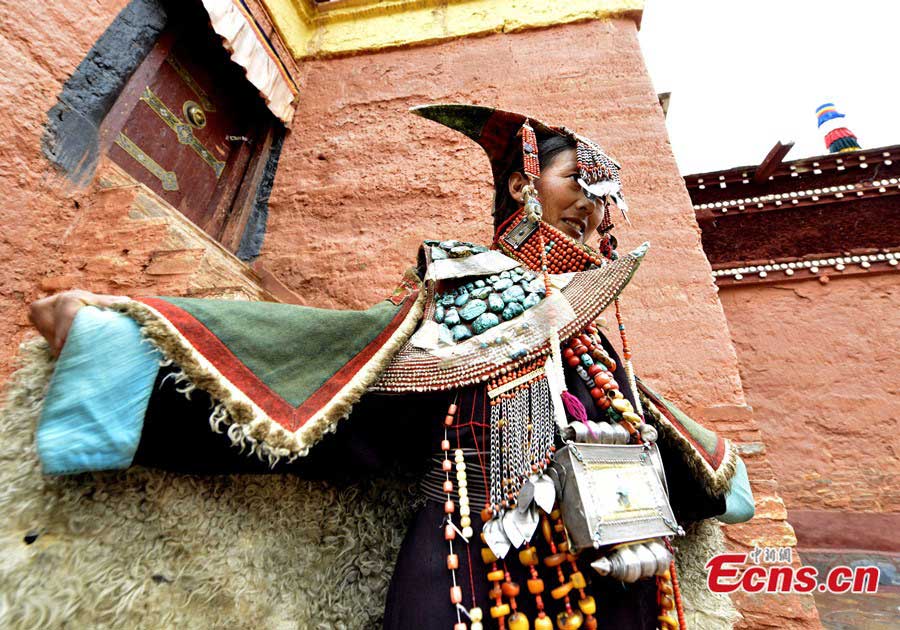 A Tibetan woman in traditional 'peacock costume' in a village of Burang County, Ngari Prefecture.(CNS/Li Lin)