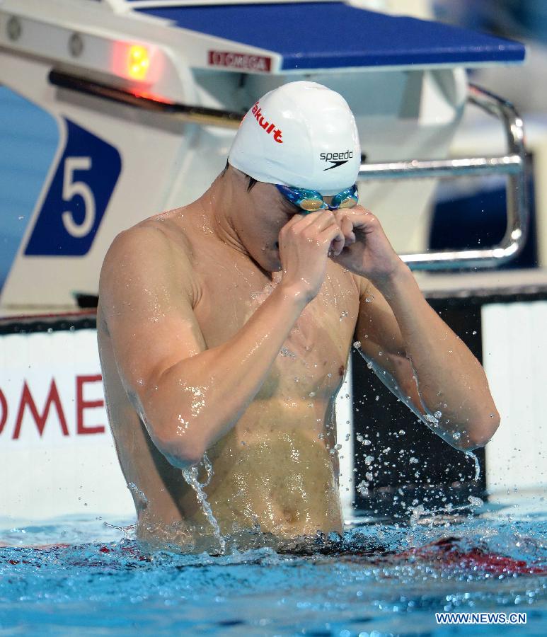 Sun Yang of China reacts after winning the men's 800m freestyle final of the swimming competition at the 15th FINA World Championships in Barcelona, Spain on July 31, 2013. Sun Yang won the gold medal with 7 minutes and 41.36 seconds. (Xinhua/Guo Yong)