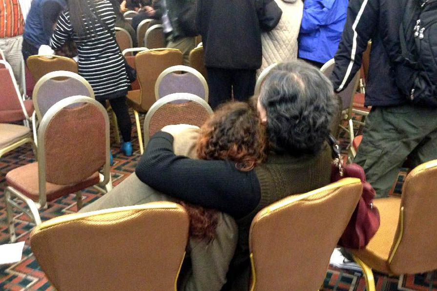 Relatives of passengers on MH370 watch press conference TV live at Lido Hotel in Beijing