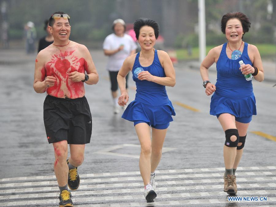 People wearing underwear take part in a running race in Nanjing, capital of east China's Jiangsu Province, March 29, 2014. A special race was held here on Saturday, in which participants wore only underwear so as to advocate the 2014 Earth Hour event and promote the concept of green lifestyle. (Xinhua/Shen Peng) 