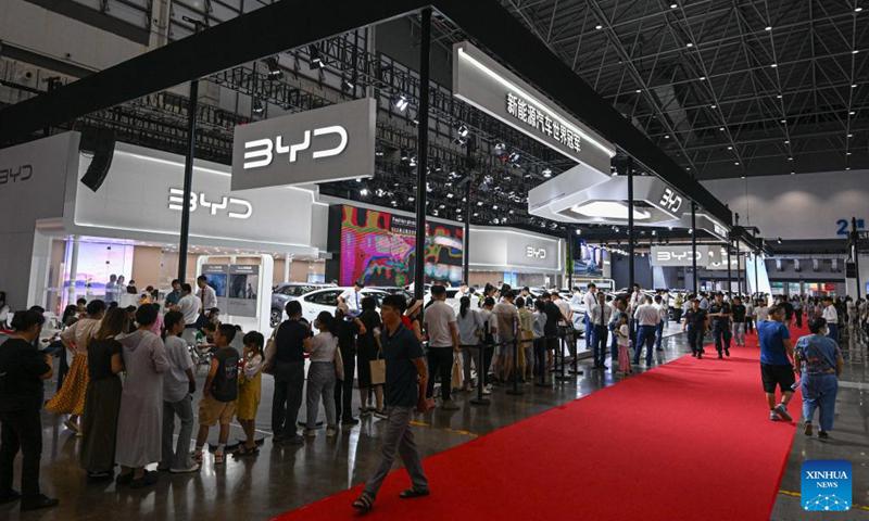 People visit the 2024 Hainan Autumn Auto Show in Hainan International Conference and Exhibition Center in Haikou, capital of south China's Hainan Province, Sept. 16, 2024. The show was held from Sept. 13 to 16, with nearly one hundred car manufacturers showcasing their products on a display area of more than 50,000 square meters. About 70 percent of the exhibited vehicles were new energy vehicles.  (Photo: Xinhua)