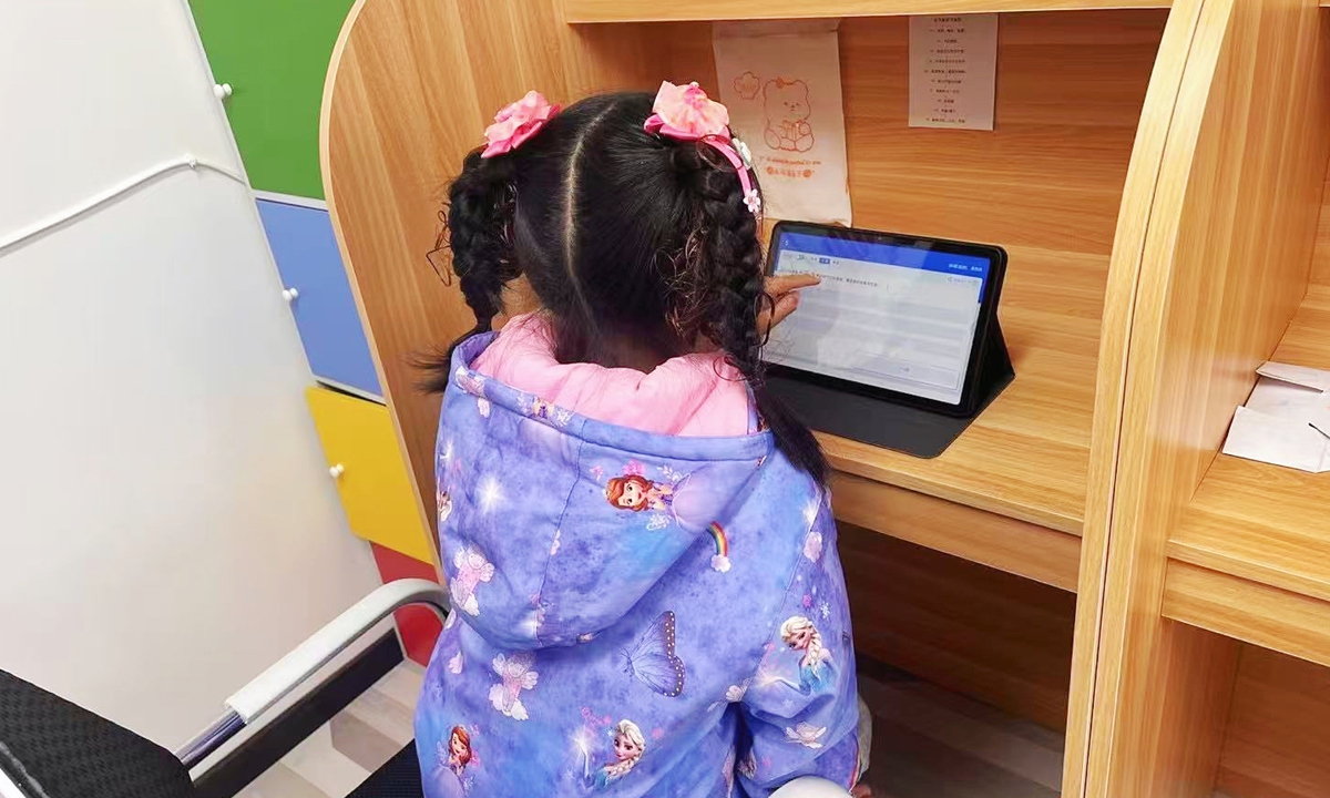 A student uses the learning devices to study in an AI self-study room in Beijing's Fengtai District in December, 2024.